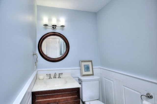1221 Merritt St, Fairfield, CT 06825 - half bath featuring vanity and toilet