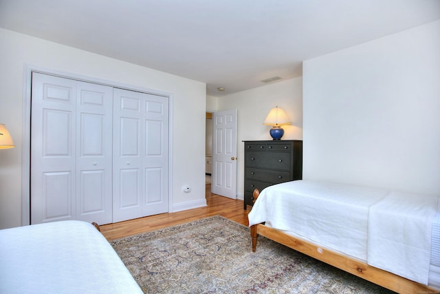 1221 Merritt St, Fairfield, CT 06825 - bedroom with wood finished floors and a closet