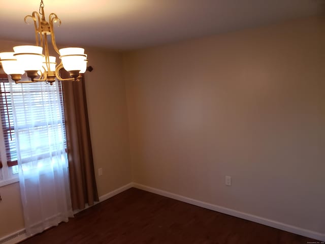 51 Savin Park Unit 51, West Haven, CT 06516 - empty room with a chandelier and dark wood finished floors