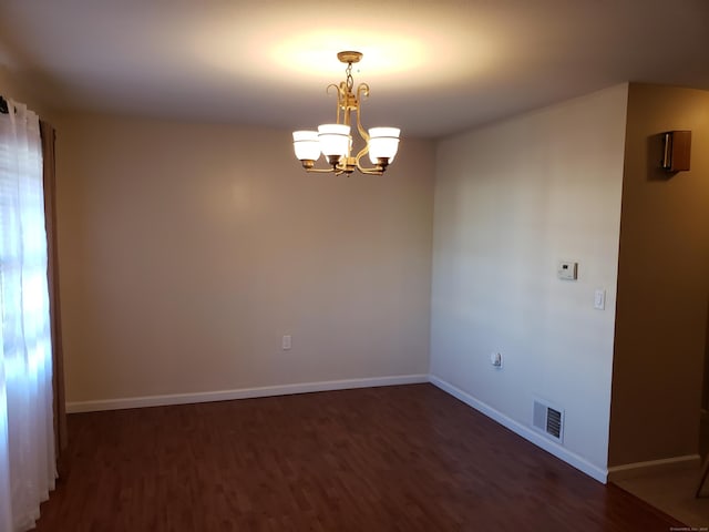 51 Savin Park Unit 51, West Haven, CT 06516 - unfurnished room featuring dark wood-style floors and a chandelier
