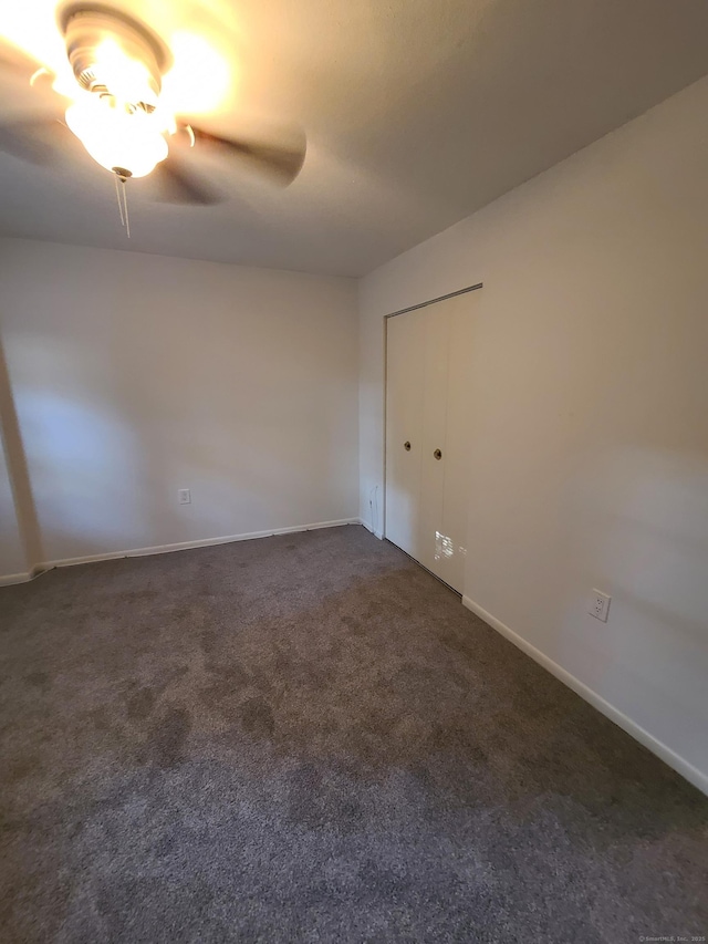 51 Savin Park Unit 51, West Haven, CT 06516 - spare room featuring ceiling fan and dark carpet