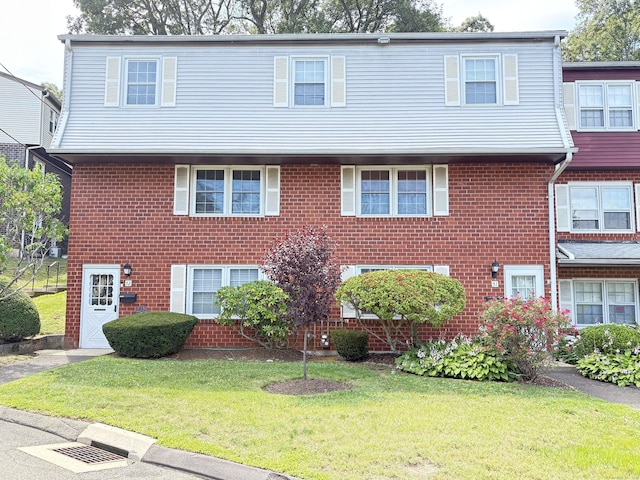 51 Savin Park Unit 51, West Haven, CT 06516 - colonial-style house featuring a front lawn and brick siding