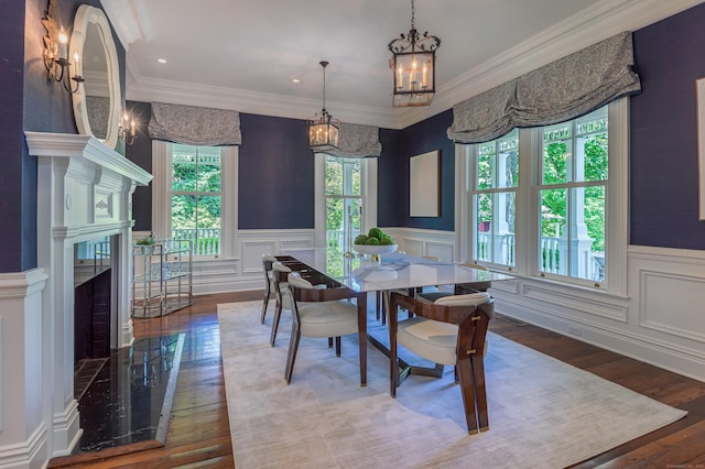 14 Market St, Ridgefield, CT 06877 - dining area with a chandelier, a decorative wall, hardwood / wood-style floors, a wainscoted wall, and ornamental molding