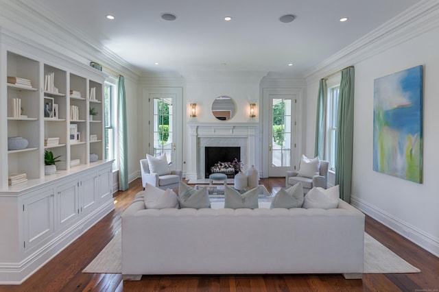 14 Market St, Ridgefield, CT 06877 - living area featuring healthy amount of natural light, dark wood-style floors, ornamental molding, a fireplace, and recessed lighting