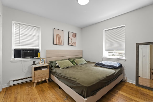 212 Sheffield Ave, New Haven, CT 06511 - bedroom featuring a baseboard heating unit, cooling unit, and light wood finished floors