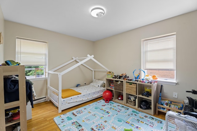 212 Sheffield Ave, New Haven, CT 06511 - bedroom featuring wood finished floors and a baseboard heating unit