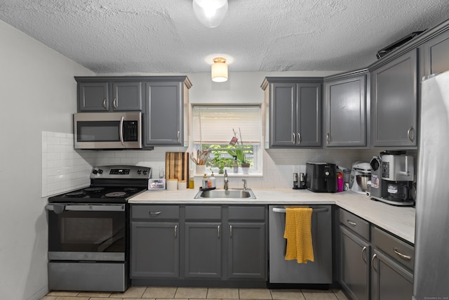 212 Sheffield Ave, New Haven, CT 06511 - kitchen with stainless steel appliances, tasteful backsplash, light countertops, and a textured ceiling