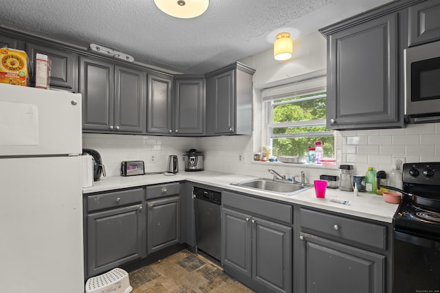 212 Sheffield Ave, New Haven, CT 06511 - kitchen with appliances with stainless steel finishes, gray cabinets, backsplash, a textured ceiling, and light countertops