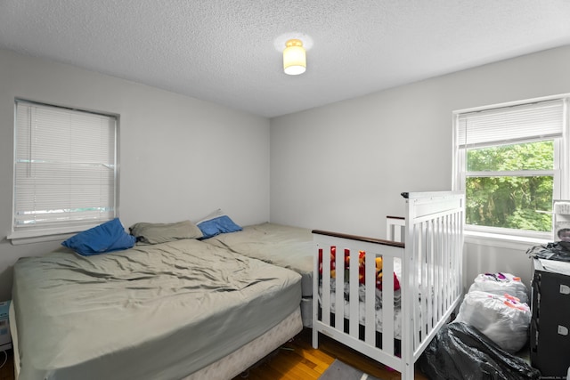 212 Sheffield Ave, New Haven, CT 06511 - bedroom with wood finished floors and a textured ceiling