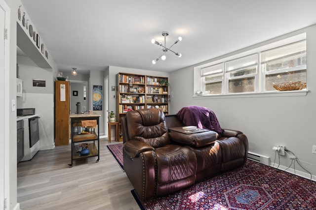 212 Sheffield Ave, New Haven, CT 06511 - living area with a baseboard heating unit, light wood finished floors, and a chandelier
