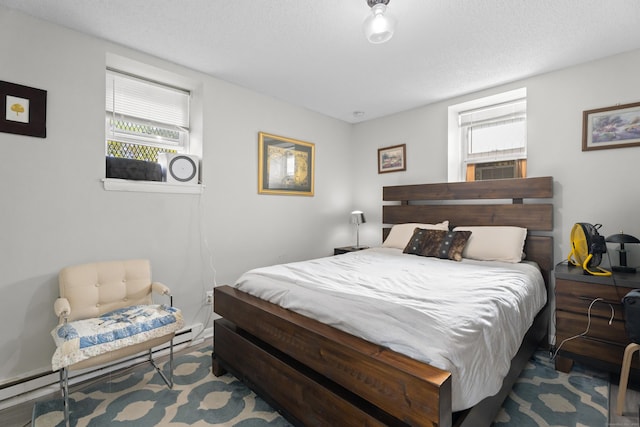 212 Sheffield Ave, New Haven, CT 06511 - bedroom with multiple windows, a baseboard heating unit, cooling unit, and a textured ceiling