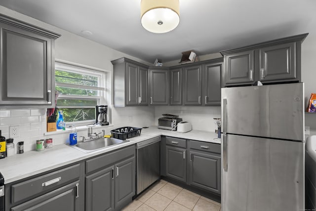 212 Sheffield Ave, New Haven, CT 06511 - kitchen featuring appliances with stainless steel finishes, gray cabinets, and decorative backsplash