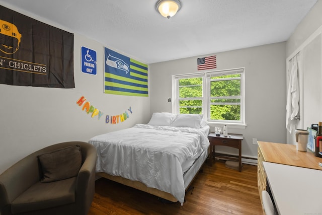 212 Sheffield Ave, New Haven, CT 06511 - bedroom with wood finished floors and a baseboard heating unit