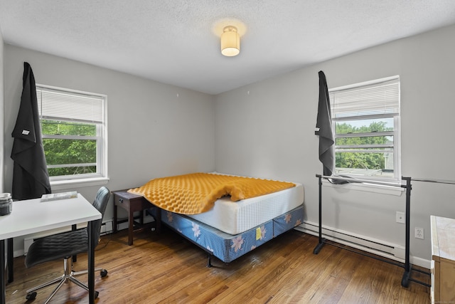 212 Sheffield Ave, New Haven, CT 06511 - bedroom with a baseboard radiator and wood finished floors