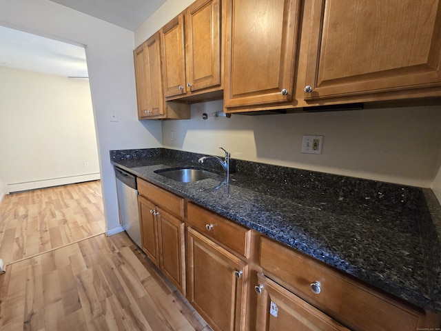 655 Talcottville Rd Apt 89, Vernon, CT 06066 - kitchen with a baseboard radiator, dishwasher, light wood finished floors, brown cabinets, and dark stone counters