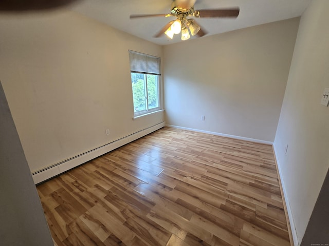 655 Talcottville Rd Apt 89, Vernon, CT 06066 - empty room featuring a baseboard radiator, wood finished floors, and a ceiling fan