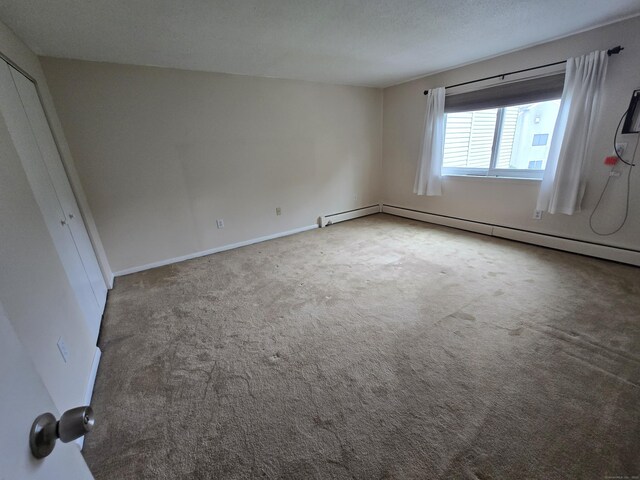 655 Talcottville Rd Apt 89, Vernon, CT 06066 - unfurnished bedroom featuring carpet flooring and a baseboard radiator