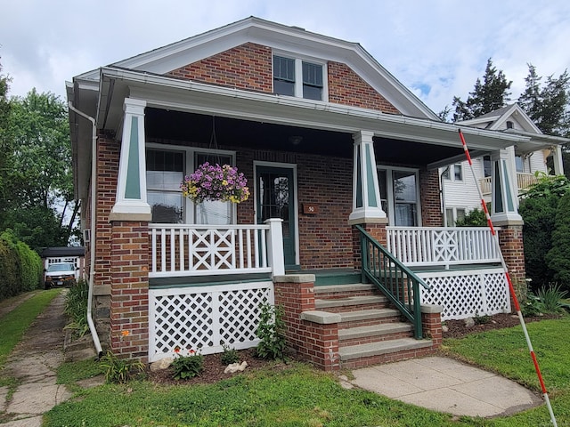 50 Tracy Ave, Waterbury, CT 06706 - view of front of home featuring covered porch and brick siding