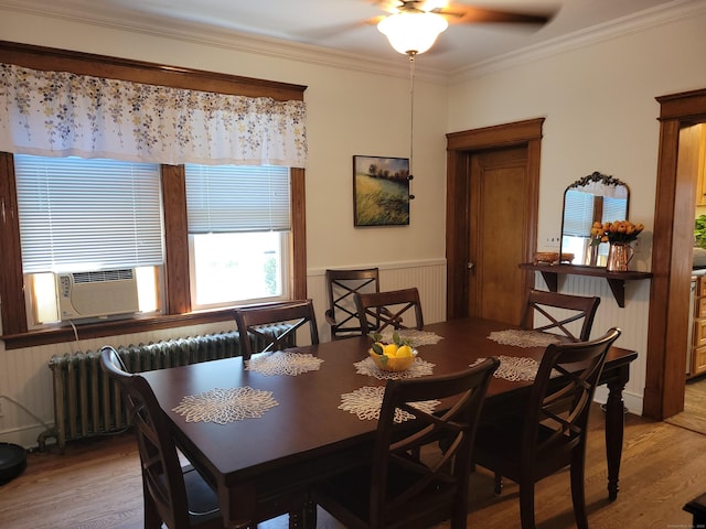 50 Tracy Ave, Waterbury, CT 06706 - dining space featuring radiator, light wood-style floors, ceiling fan, crown molding, and cooling unit