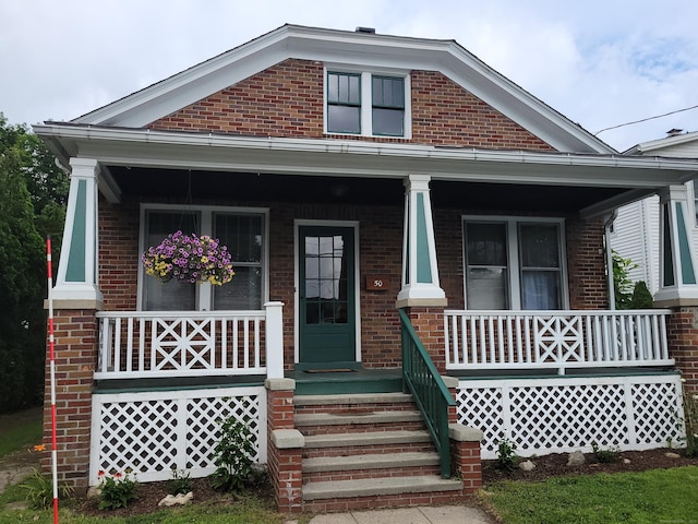 50 Tracy Ave, Waterbury, CT 06706 - view of front of house with a porch and brick siding