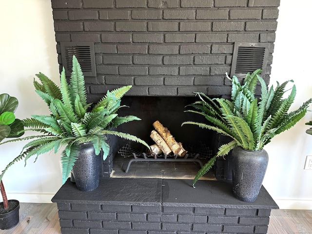 26 Nejako Dr, Middletown, CT 06457 - detailed view of a brick fireplace and wood finished floors