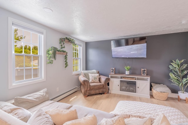282 Montgomery Rd, Westfield, MA 01085 - living room with a baseboard radiator and light wood-style floors