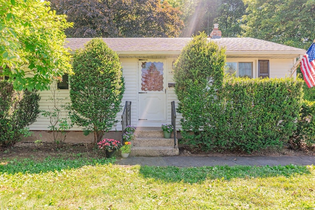 156 Overhill Dr, Berlin, CT 06037 - view of front of property featuring a front yard, entry steps, and a chimney