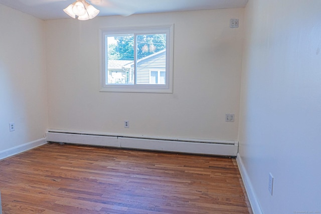156 Overhill Dr, Berlin, CT 06037 - empty room with baseboard heating and wood finished floors