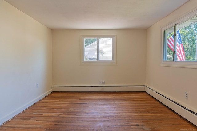 156 Overhill Dr, Berlin, CT 06037 - spare room with baseboard heating and wood finished floors