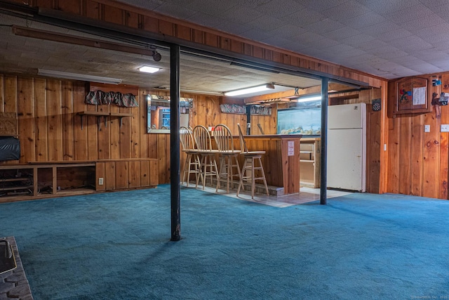 156 Overhill Dr, Berlin, CT 06037 - finished below grade area featuring freestanding refrigerator, a bar, carpet flooring, and wood walls