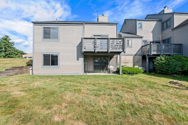 578 Pilgrim Hbr Unit 578, Wallingford, CT 06492 - back of house featuring a chimney, a lawn, and a patio