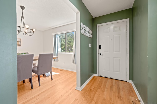 578 Pilgrim Hbr Unit 578, Wallingford, CT 06492 - entryway with a chandelier and light wood finished floors