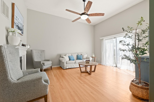578 Pilgrim Hbr Unit 578, Wallingford, CT 06492 - living room featuring light wood finished floors, a ceiling fan, and a fireplace