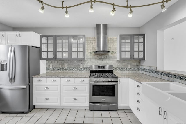 5 Mansfield Grove Rd Apt 341, East Haven, CT 06512 - kitchen with appliances with stainless steel finishes, wall chimney exhaust hood, glass insert cabinets, and tasteful backsplash