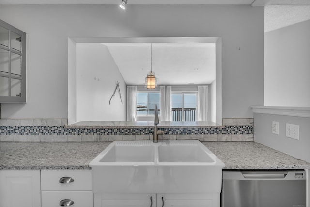 5 Mansfield Grove Rd Apt 341, East Haven, CT 06512 - kitchen with stainless steel dishwasher, glass insert cabinets, white cabinetry, light stone counters, and tasteful backsplash