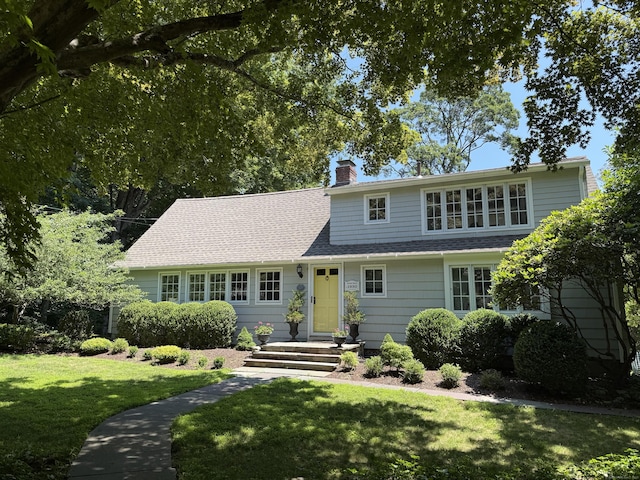 35 Rayfield Rd, Westport, CT 06880 - view of front of house featuring a front lawn, a chimney, and a shingled roof