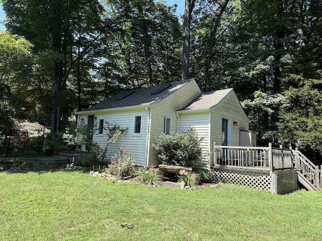 35 Rayfield Rd, Westport, CT 06880 - view of side of property with a deck, a yard, and a shingled roof