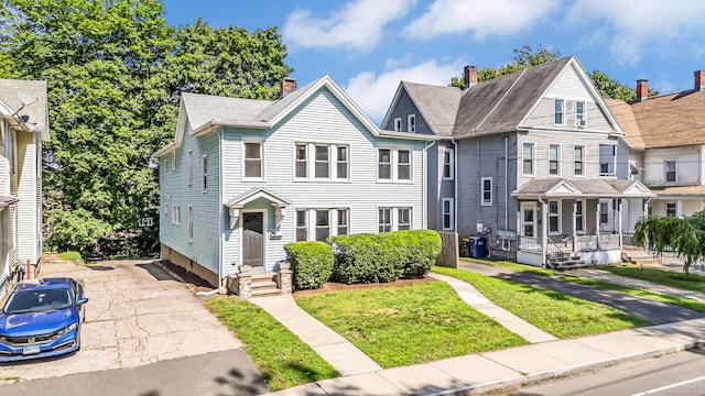 222 Wakelee Ave, Ansonia, CT 06401 - townhome / multi-family property featuring a porch and a front yard