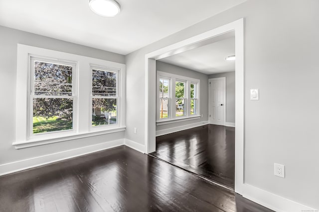 222 Wakelee Ave, Ansonia, CT 06401 - empty room featuring dark wood-style flooring and baseboards