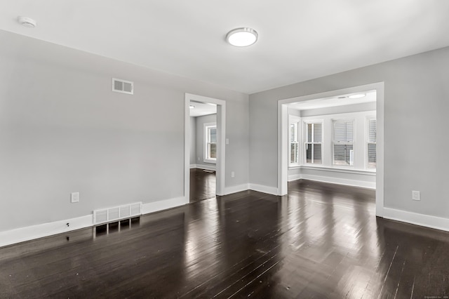 222 Wakelee Ave, Ansonia, CT 06401 - unfurnished living room with dark wood finished floors and baseboards
