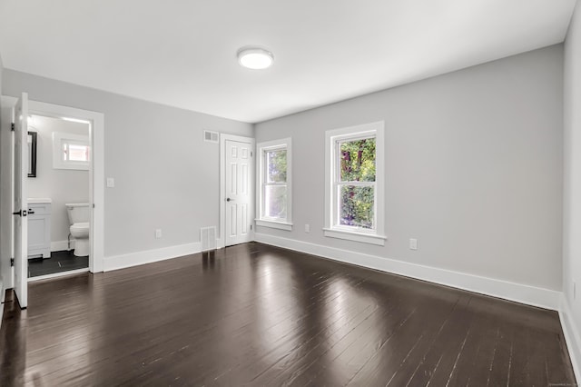 222 Wakelee Ave, Ansonia, CT 06401 - unfurnished bedroom featuring dark wood-style flooring and ensuite bathroom