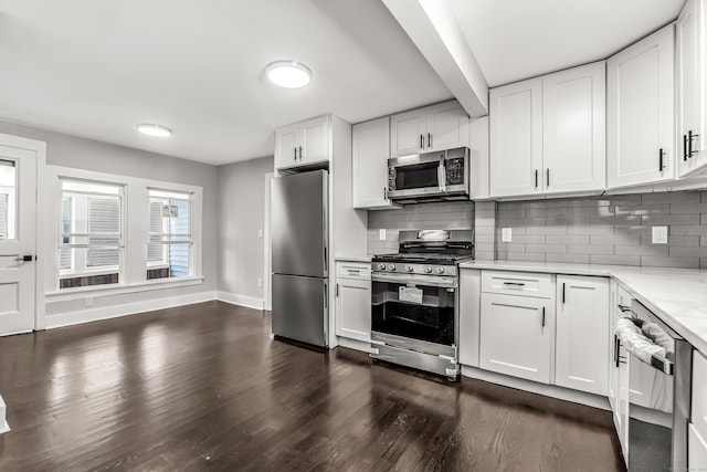 222 Wakelee Ave, Ansonia, CT 06401 - kitchen featuring stainless steel appliances, dark wood-type flooring, backsplash, and white cabinets