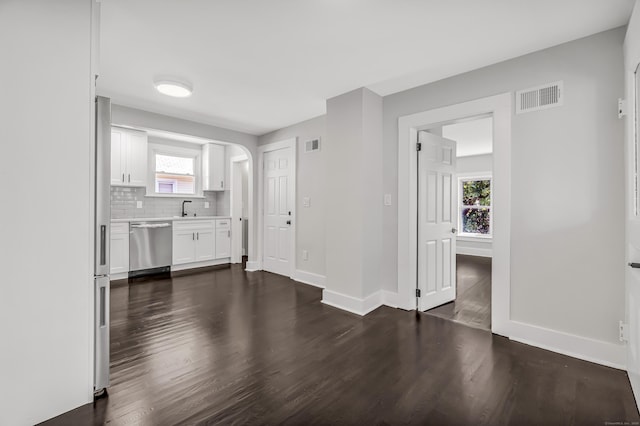 222 Wakelee Ave, Ansonia, CT 06401 - unfurnished living room with dark wood-type flooring and arched walkways