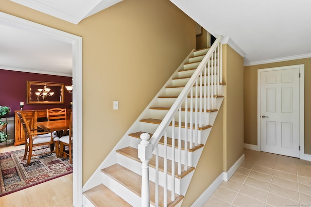 4 Adams Rd, Simsbury, CT 06089 - stairs with crown molding, tile patterned floors, and a chandelier