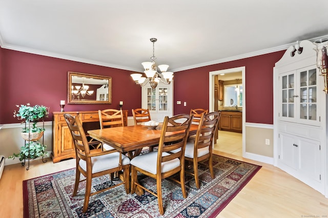 4 Adams Rd, Simsbury, CT 06089 - dining space featuring a chandelier, light wood finished floors, and crown molding
