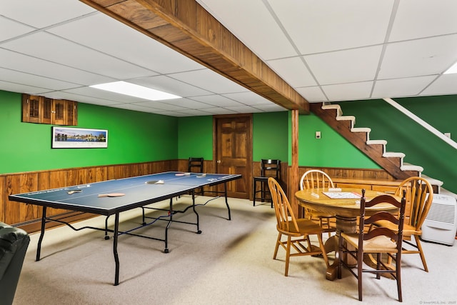 4 Adams Rd, Simsbury, CT 06089 - rec room with a paneled ceiling, carpet floors, wooden walls, and a wainscoted wall