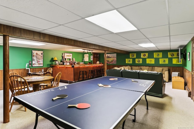 4 Adams Rd, Simsbury, CT 06089 - recreation room with a dry bar, a paneled ceiling, carpet flooring, wood walls, and wainscoting