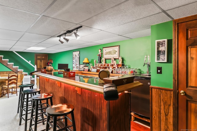 4 Adams Rd, Simsbury, CT 06089 - indoor bar featuring a drop ceiling, rail lighting, refrigerator, and stairs