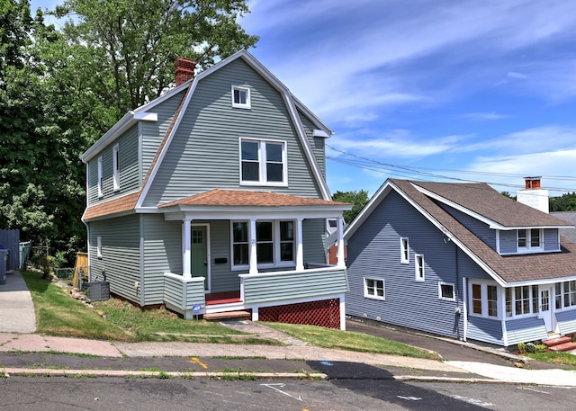 21 Orange Ter, West Haven, CT 06516 - dutch colonial featuring a chimney, covered porch, a gambrel roof, and roof with shingles