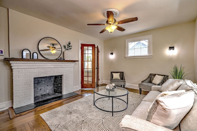 21 Orange Ter, West Haven, CT 06516 - living room featuring a ceiling fan, wood finished floors, and a brick fireplace